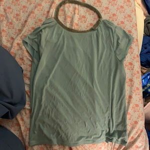 Jennifer Lopez teal short sleeved top